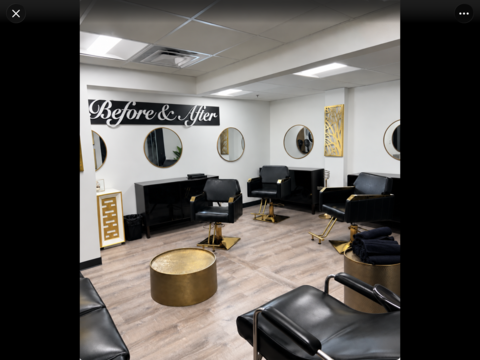 Inside Before and After The Salon: black and gold styling chairs, round gold mirrors and the Before & After sign on a white wall